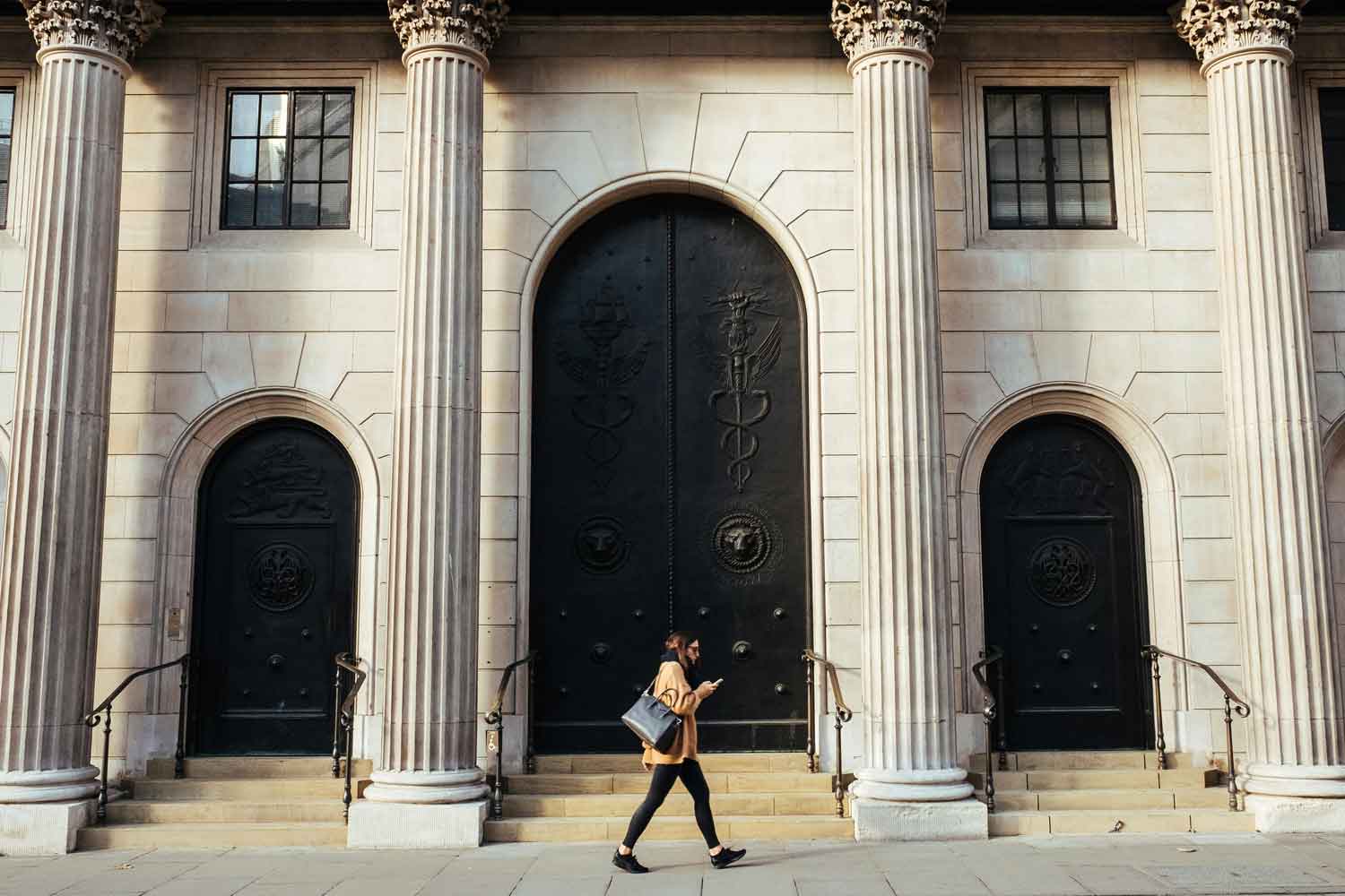 woman in front of a bank